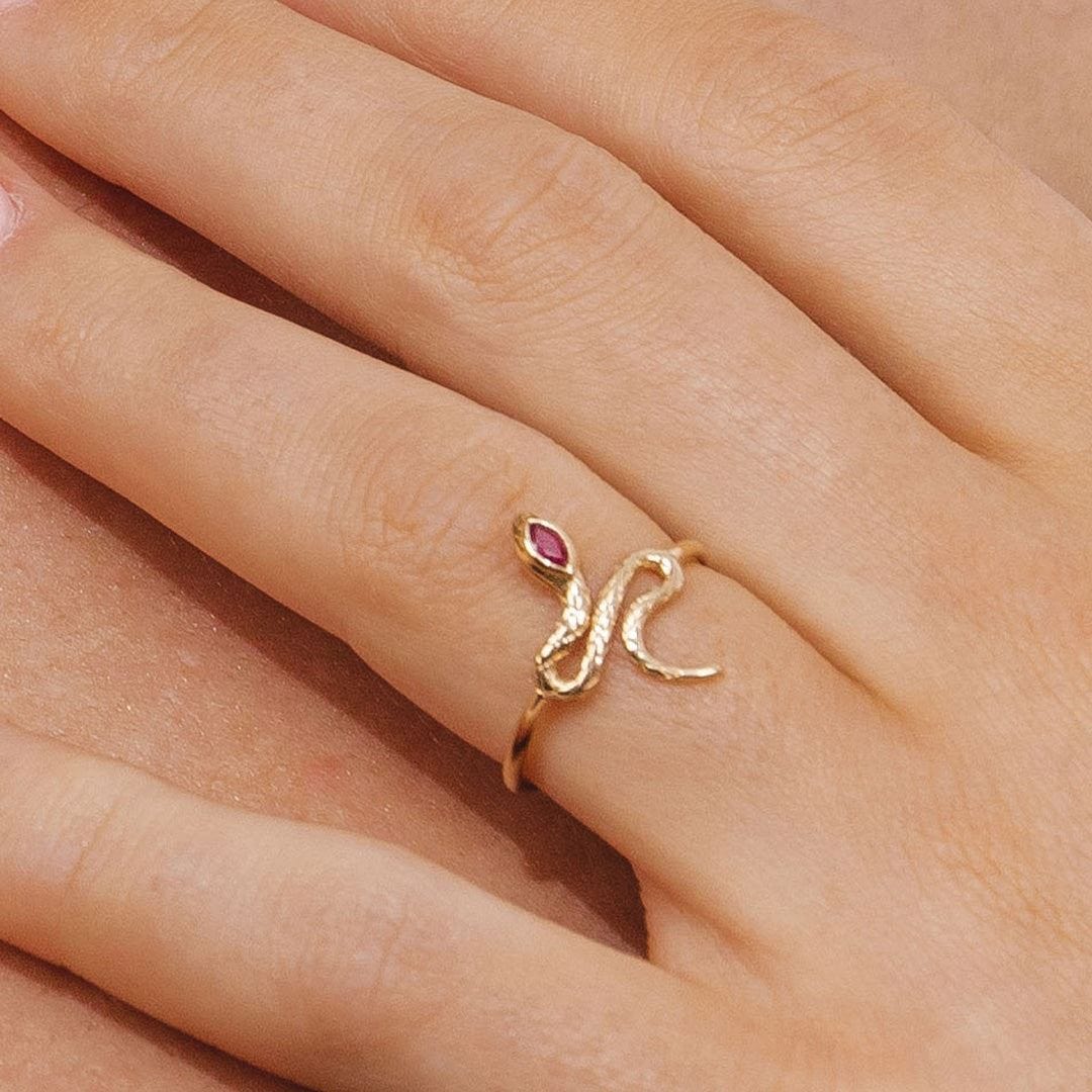 132R8457029 ECFEW™ Ruby Winding Snake Ring in 9ct Yellow Gold On Model