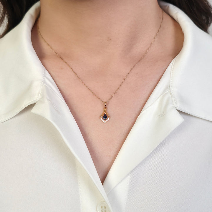 Classic Pear Sapphire & Three Diamond Leaf Halo Pendant in 9ct Yellow Gold