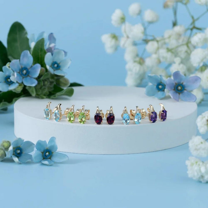 Classic Oval Sky Blue Topaz Stud Earrings in 9ct Yellow Gold 7x5mm