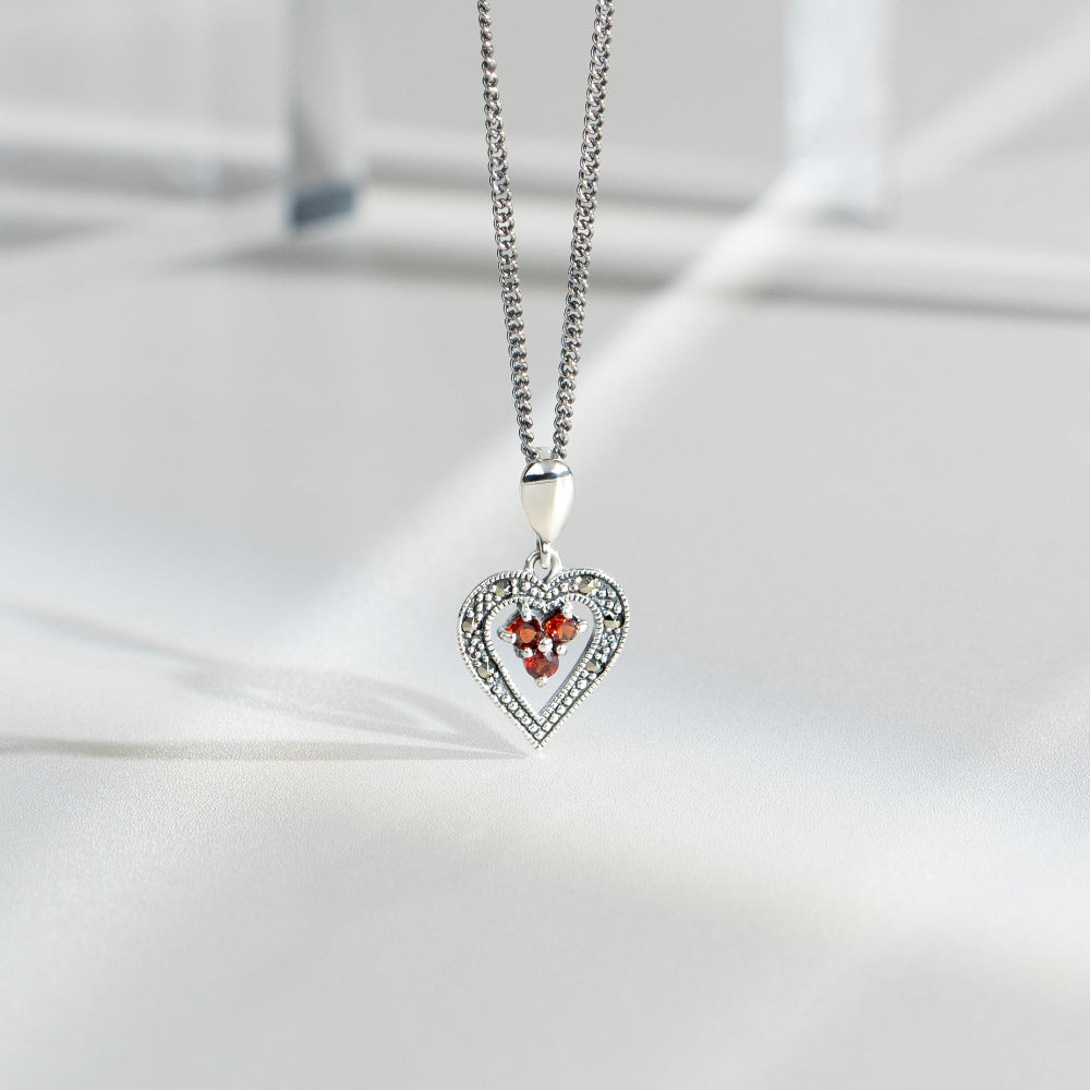Art Deco Style Round Garnet & Marcasite Pendant in 925 Sterling Silver flatlay