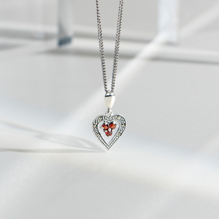 Art Deco Style Round Garnet & Marcasite Pendant in 925 Sterling Silver flatlay
