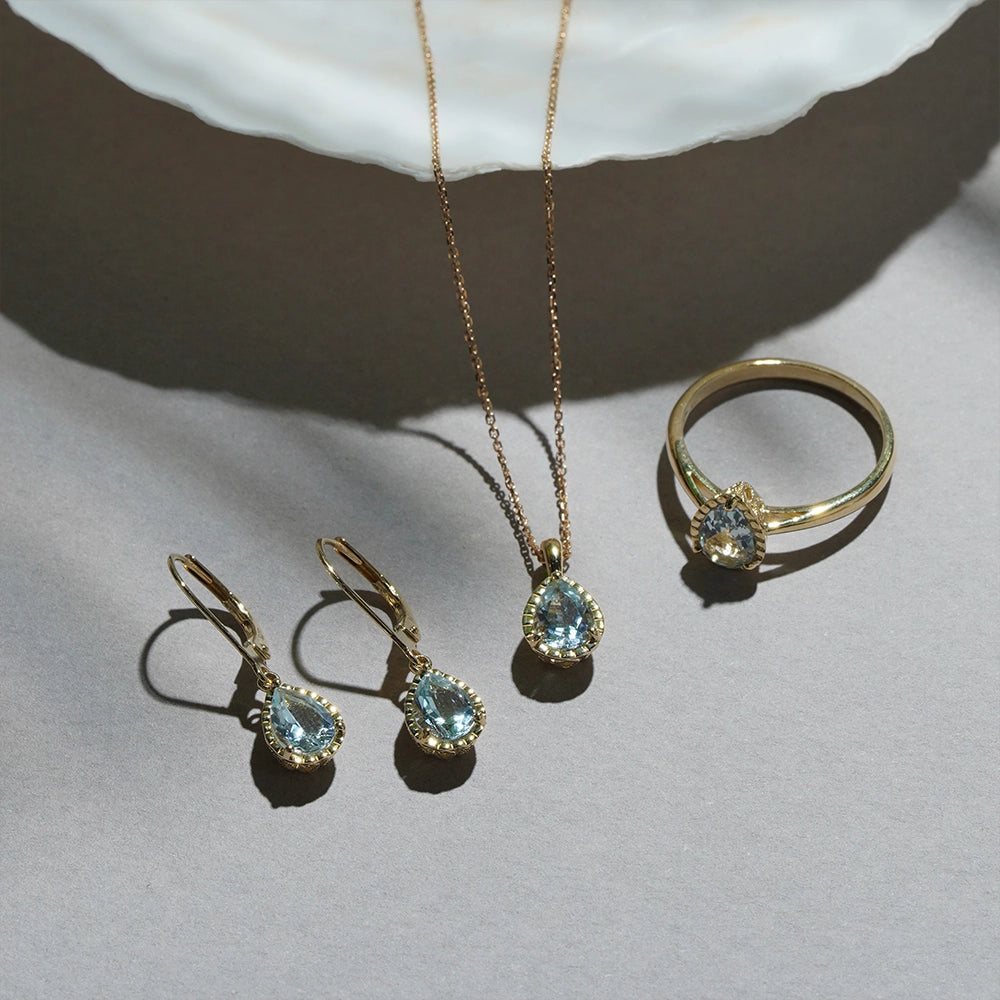 Classic_Pear_Aquamarine_ring_hoop_drop_earrings_and_pendant_necklace_in_9ct_yellow_gold