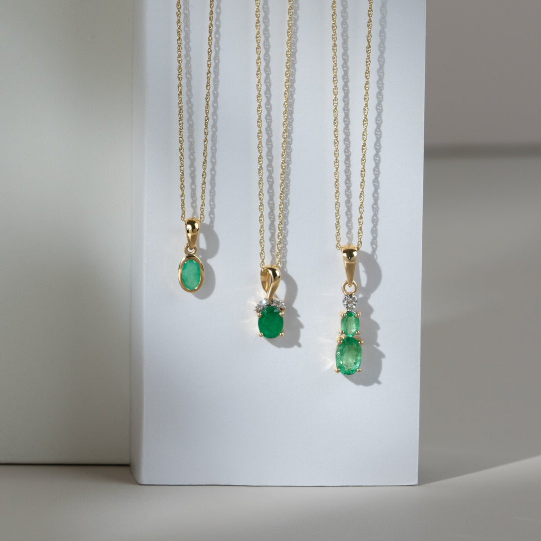 Classic Oval Emerald & Diamond Twisted Bale Pendant in 9ct Yellow Gold