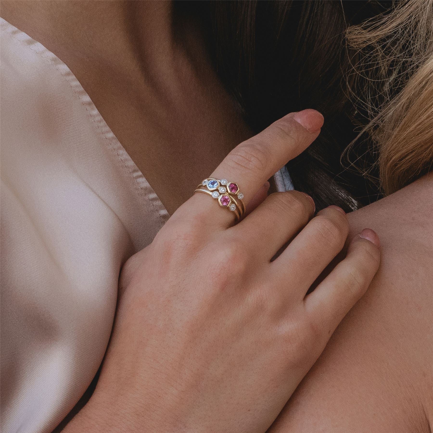 Geometric Round Tanzanite and Sapphire Ring in 9ct Yellow Gold On Model